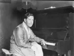 Arthur Benjamin sitting at his piano in 1929
